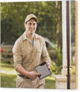 Service: Latin Descent Repairman At Customer's Front Door. Digital Tablet. Wood Print