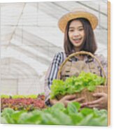 Shot Of A Young Woman Holding A Crate Full Of Freshly Picked Produce On A Farm Wood Print