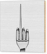 Silver Fork Bent To Form Hand Sign On Black Wood Print