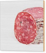 Slices Of Salami Sausages Isolated On A White Background Wood Print