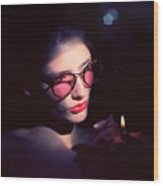 Studio Portrait Of Young Woman Wearing Glasses Wood Print