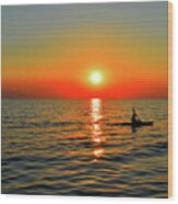 Sunset Above Seascape With Kayaker Wood Print