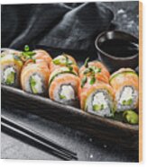 Sushi Roll Philadelphia With Salmon, Avocado, Cream Cheese. Sushi Menu. Japanese Food. Black Background. Top View Wood Print