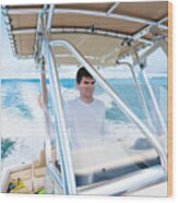 Teenager Driving A Boat Wood Print