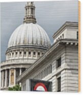 The Dome Of St Paul's Cathedral Behind A London Underground Roundel Sign. Focus On The Iconic Red, White And Blue Tube Logo In Foreground. Wood Print