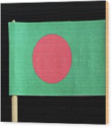 The National Flag Of Bangladesh On Toothpick On Black Background. A Red Disc On A Green Field Wood Print