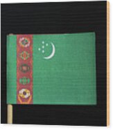 The National Flag Of Turkmenistan On Toothpick On Black Background. A Green Field With A Vertical Red Stripe Near The Hoist Side Wood Print