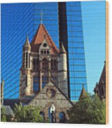 Trinity Church In Front Of The Shiny Metallic Facade Of 200 Clarendon, The Former John Hancock Tower Wood Print