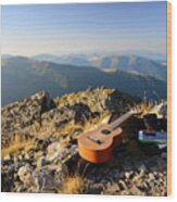 Ukulele Resting On A Mountain Summit Wood Print