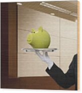 Waiter Holding Piggy Bank On Serving Tray Wood Print