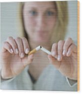 Woman Breaking Cigarette Wood Print