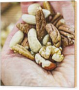 Woman Holding Handful Of Fresh Nuts. Mixed Whole Nuts. Nut Sources Of Vitamin B9 Folate Wood Print