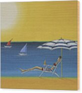 Woman Lying On A Sun Lounger Under A Parasol On A Sunny Beach Wood Print