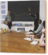 Woman Pointing At Growth Chart Of Carrots Wood Print