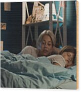 Woman Telling Story To Girl In Bed Wood Print