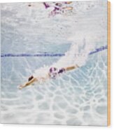 Young Male Swimmer Diving Into Pool Wood Print