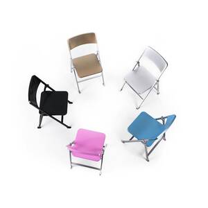 Circle Of Chairs Of Different Colours #1 by Science Photo Library