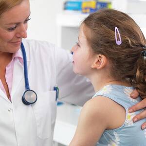 Doctor Caring For Patient #1 by Science Photo Library