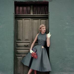 A 1950s Model Standing In A Doorway by Leombruno-Bodi