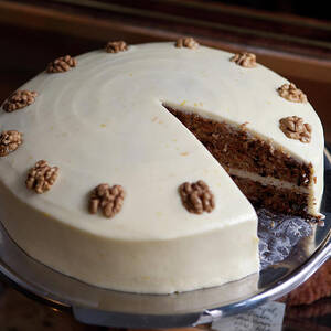 A Carrot Cake On A Display Cabinet In A by Halfdark