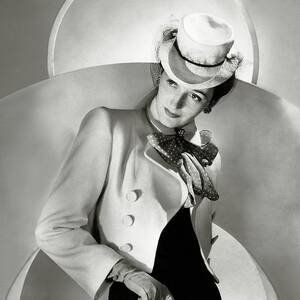 A Model Wearing A Jacket And Hat by Horst P. Horst