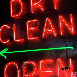 A Neon Sign Reading Dry Clean Open by Ron Koeberer