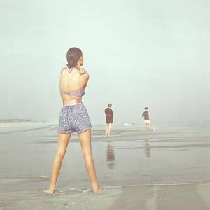 Back View Of Three People At A Beach by Serge Balkin