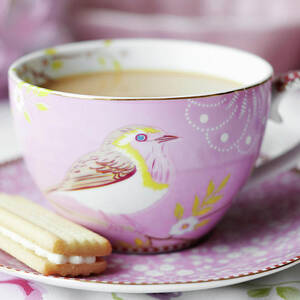 Close Up Of Cup Of Tea And Cookie by Debby Lewis-harrison