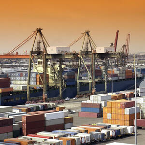 Container Ship And Lorries by Science Photo Library