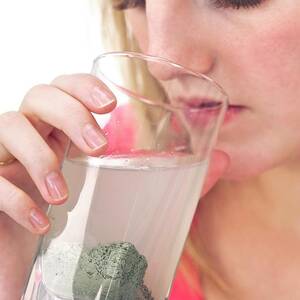 Drinking Green Clay Remedy by Science Photo Library
