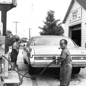 Dwarfs At Service Station by Dick Hanley