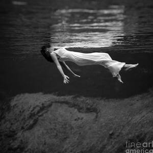 Fashion Model Floating In Water, 1947 by Science Source