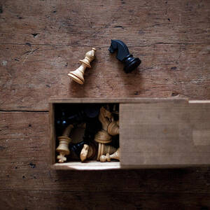 Old Chess Set On An Old Oak Table Top by Paul Strowger
