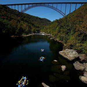 Overhead View Of A Raft Full Of People by Trevor Clark