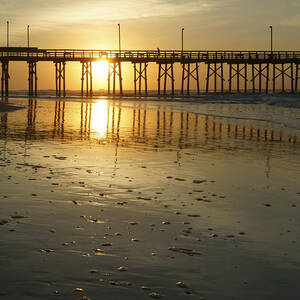 Sunrise at the Jolly Roger Pier by Mike McGlothlen
