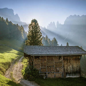 Sunrise Over A Mountain Meadow And Hut by Suzanne Stroeer