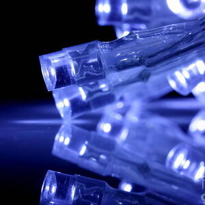 Blue LED lights closeup with reflection by Simon Bratt
