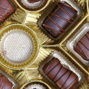 Box Of Chocolates, One Missing by Photo Researchers