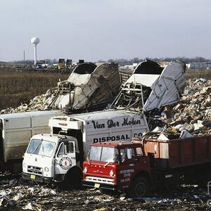 Dumping Garbage In Landfill by Roger A. Clark