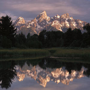 Grand Teton Range And Cloudy Sky by Tim Fitzharris