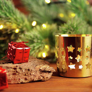 Decorative golden candlestick with stars on christmas tree background ...