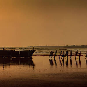 Indian fisherman carrying freshly catch fish at Malvan beach at Photograph  by Snehal Pailkar - Pixels