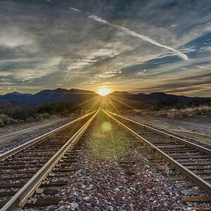 Sun sets at the end of the line by Gaelyn Olmsted