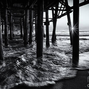 Sunset Under the Santa Monica Pier by Doug Sturgess