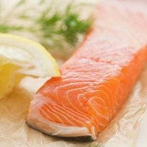 Close Up Of Salmon Meat With Lemon And by Jamie Grill