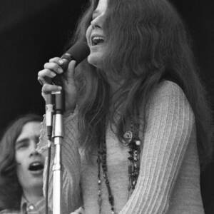 Janis Joplin Smiling And Looking Up While Singing by Globe Photos