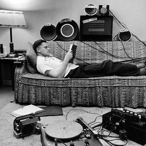 Student/soldier Jean L. Wood who has devised a method of long distance babysitting by using remote speakers. by Martha Holmes