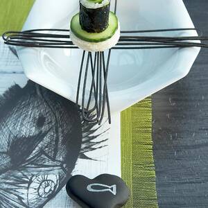 Sushi Roll On Designer Plate On Paper Place Mat With Drawing Of Fish And Green Runner by Matteo Manduzio