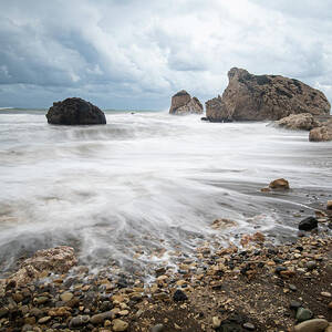 Seascape with windy waves during stormy weather on a rocky coast by Michalakis Ppalis
