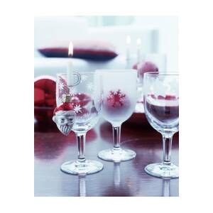 https://render.fineartamerica.com/images/rendered/square-product/small/images/artworkimages/mediumlarge/2/lit-candle-in-candle-holder-on-edge-of-etched-wine-glass-and-christmas-tree-bauble-matteo-manduzio.jpg